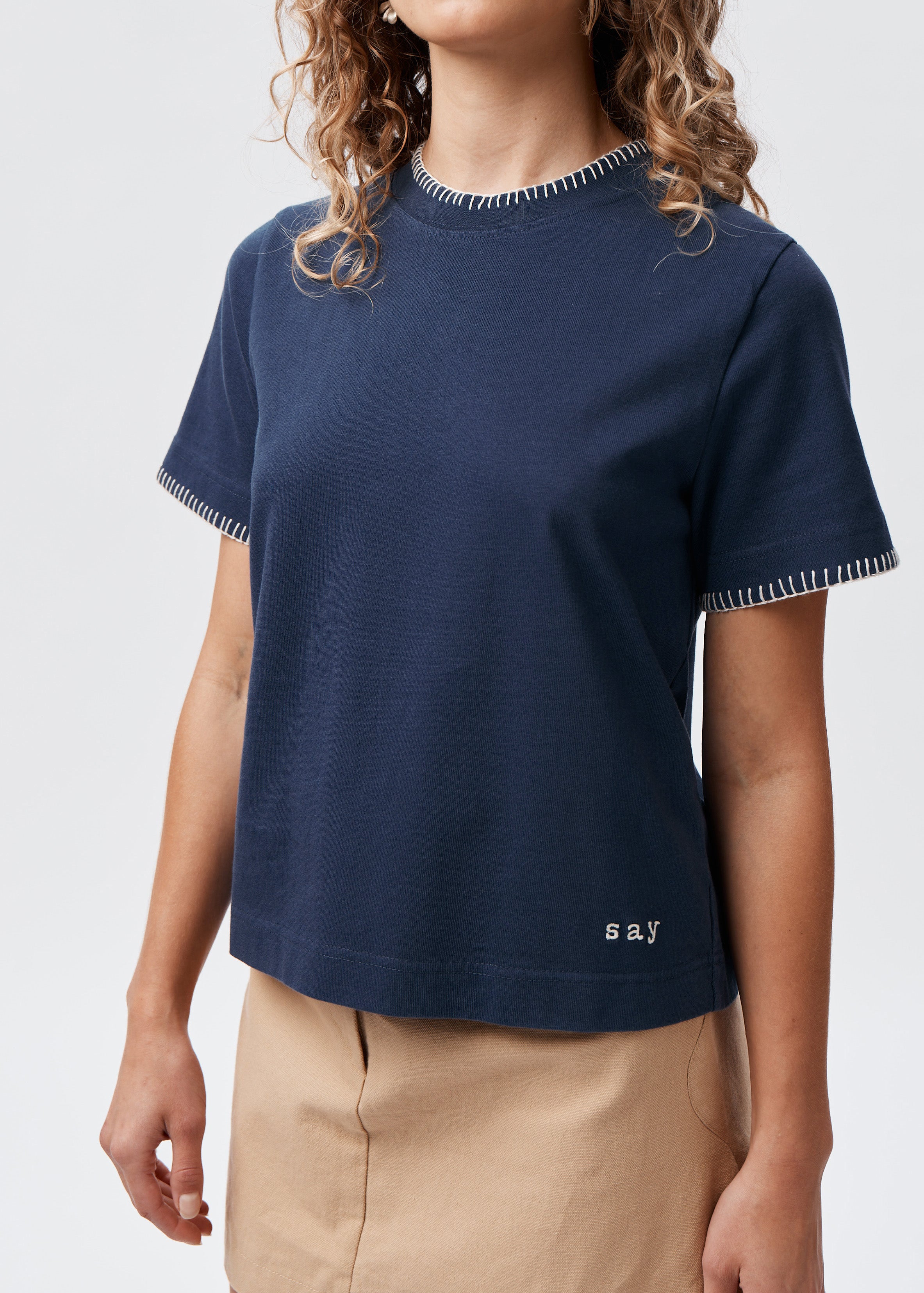 Say the Label Signature Tee in navy with contrast blanket-stitch trim and embroidered logo, front view