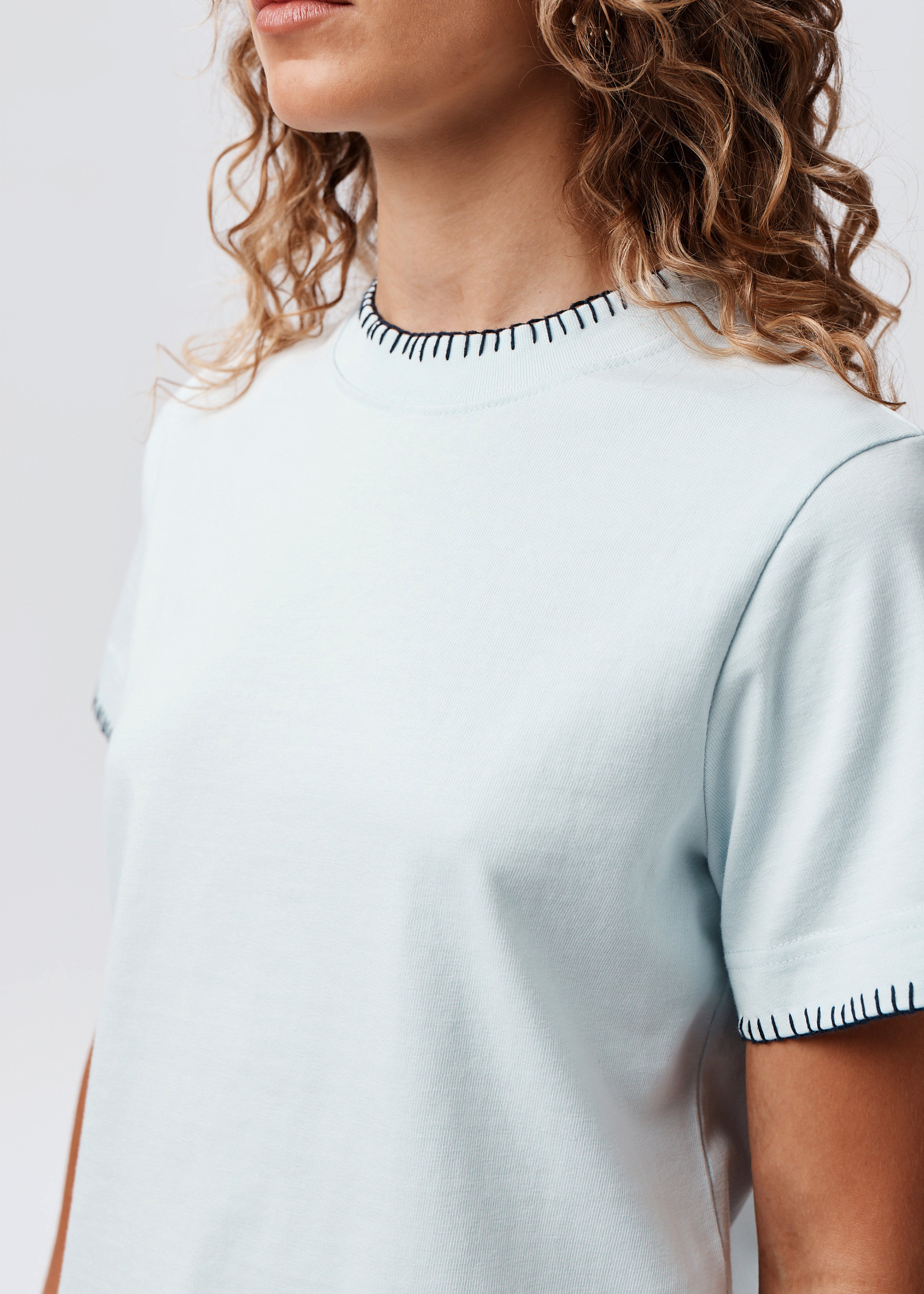 Say the Label Signature Tee in powder blue with contrast blanket-stitch trim, front view