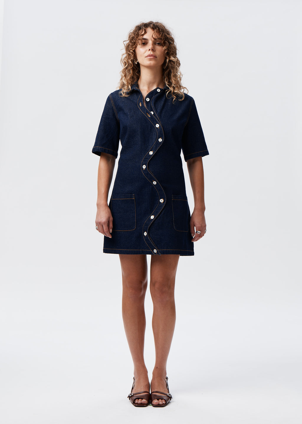 Model wearing the Say the Label Wave Denim Dress, full-length front view